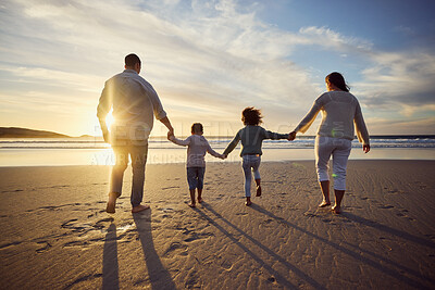 Buy stock photo Sunset, beach and back of family holding hands and walking on holiday, summer vacation and weekend. Nature, travel and mother, father and children by ocean for bonding, adventure and quality time