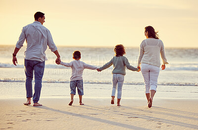 Buy stock photo Walking, beach and back of family holding hands on holiday, summer vacation and weekend at sunset. Nature, travel and mother, father and children by ocean for bonding, adventure and quality time