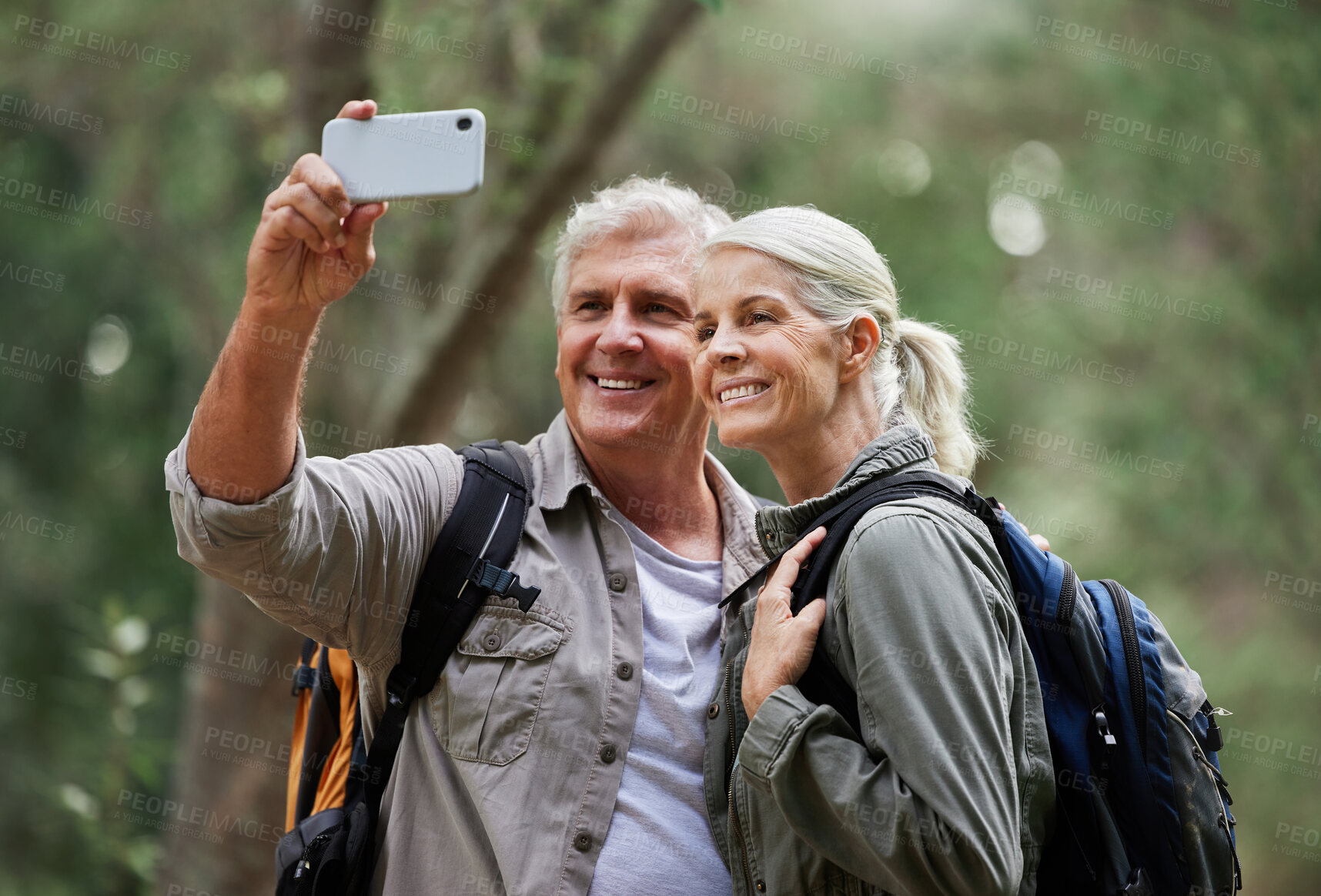 Buy stock photo Selfie, hiking and happy mature couple of friends in forest adventure, journey and outdoor health with happy blog update. Nature, travel and trekking people in woods together and profile picture post