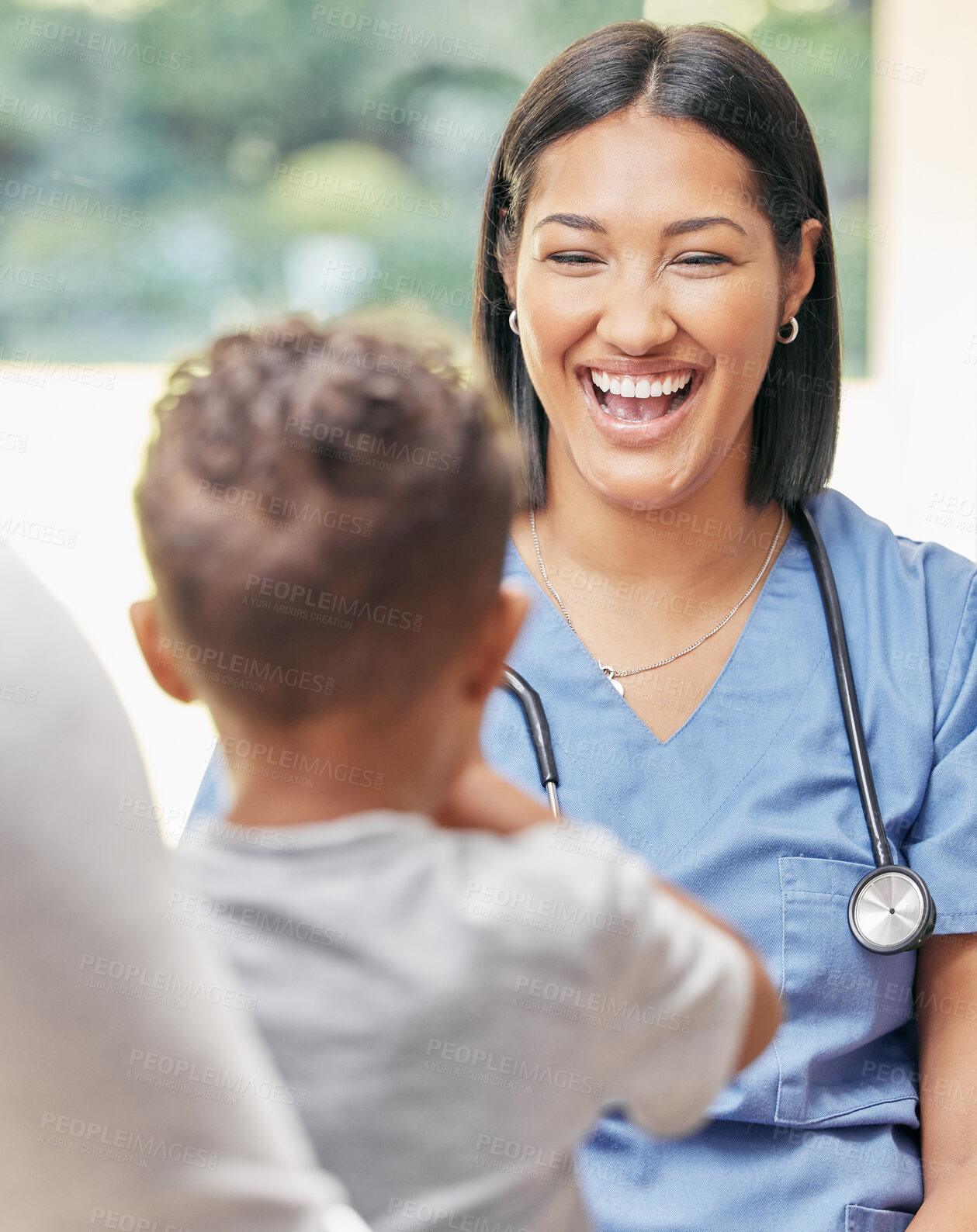 Buy stock photo Family, healthcare and nurse with a smile, patient and appointment for health issue, virus and friendly. Female person, employee or medical physician with infant, male child and caregiver in a clinic