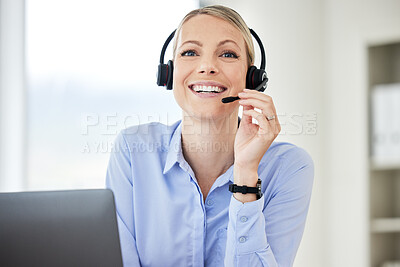 Buy stock photo Portrait of young caucasian female call centre agent talking on headset while working on computer in an office. Confident and happy businesswoman consulting and operating a helpdesk for customer sales and service support