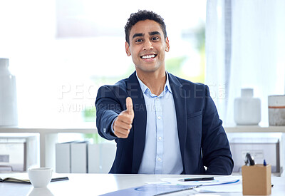 Portrait of one happy young mixed race business man gesturing thumbs up for success and agreement in an office. Confident and smiling entrepreneur expressing good luck for winning and achievement. Showing trust and support