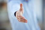 Closeup of one business man extending hand forward to greet and welcome with handshake. Networking and meeting for interview to agree on deal or offer. Collaborating on negotiation for job promotion