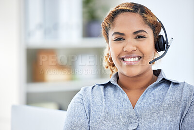 Closeup of smiling mixed race female call center agent. Business woman or translator answering calls in an office at work. Hispanic female customer service agent wearing a headset with microphone