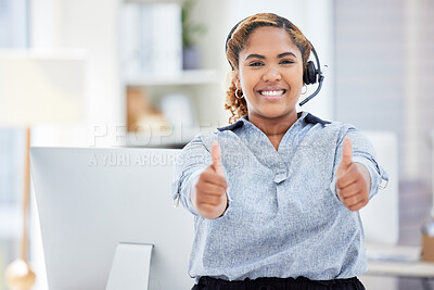 It support agent giving the thumbs up. Businesswoman working in customer service celebrating her success. Call center worker gesturing with the thumbs up. Portrait of happy helpdesk worker