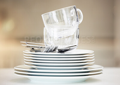 Closeup of a stack of clean dishes. Spotless pile of dishes straight out of the dishwasher