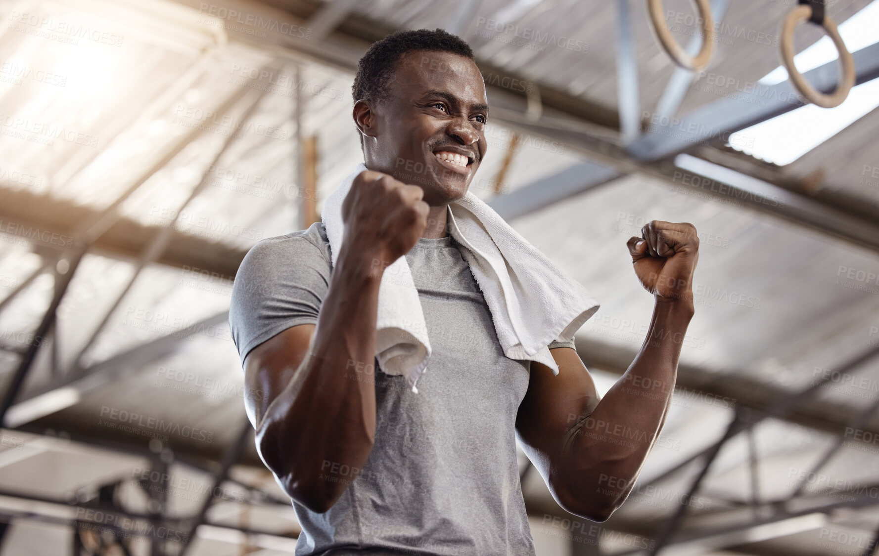 Buy stock photo Goals, success and fitness with a man at gym for exercise, training workout and strong muscle. African athlete or bodybuilder person celebrating with fist for power challenge win or achievement