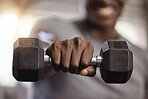 Closeup of unknown african american athlete lifting dumbbell during arm workout in gym. Strong, fit, active black man training with weight in health and sports club. Weightlifting exercise routine