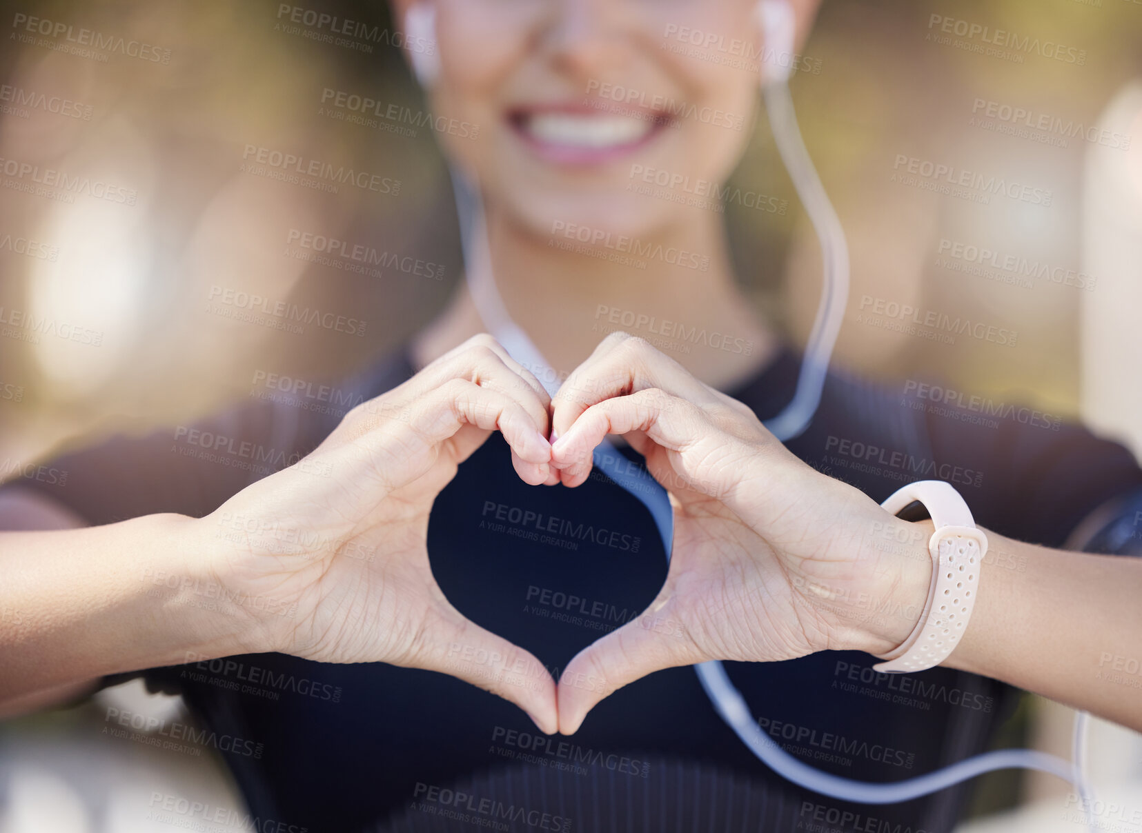 Buy stock photo Healthy, heart hands or happy girl runner in park for fitness, exercise or workout for cardiovascular health. Love sign, hand gesture or blurry sports woman in sports training for wellness in nature