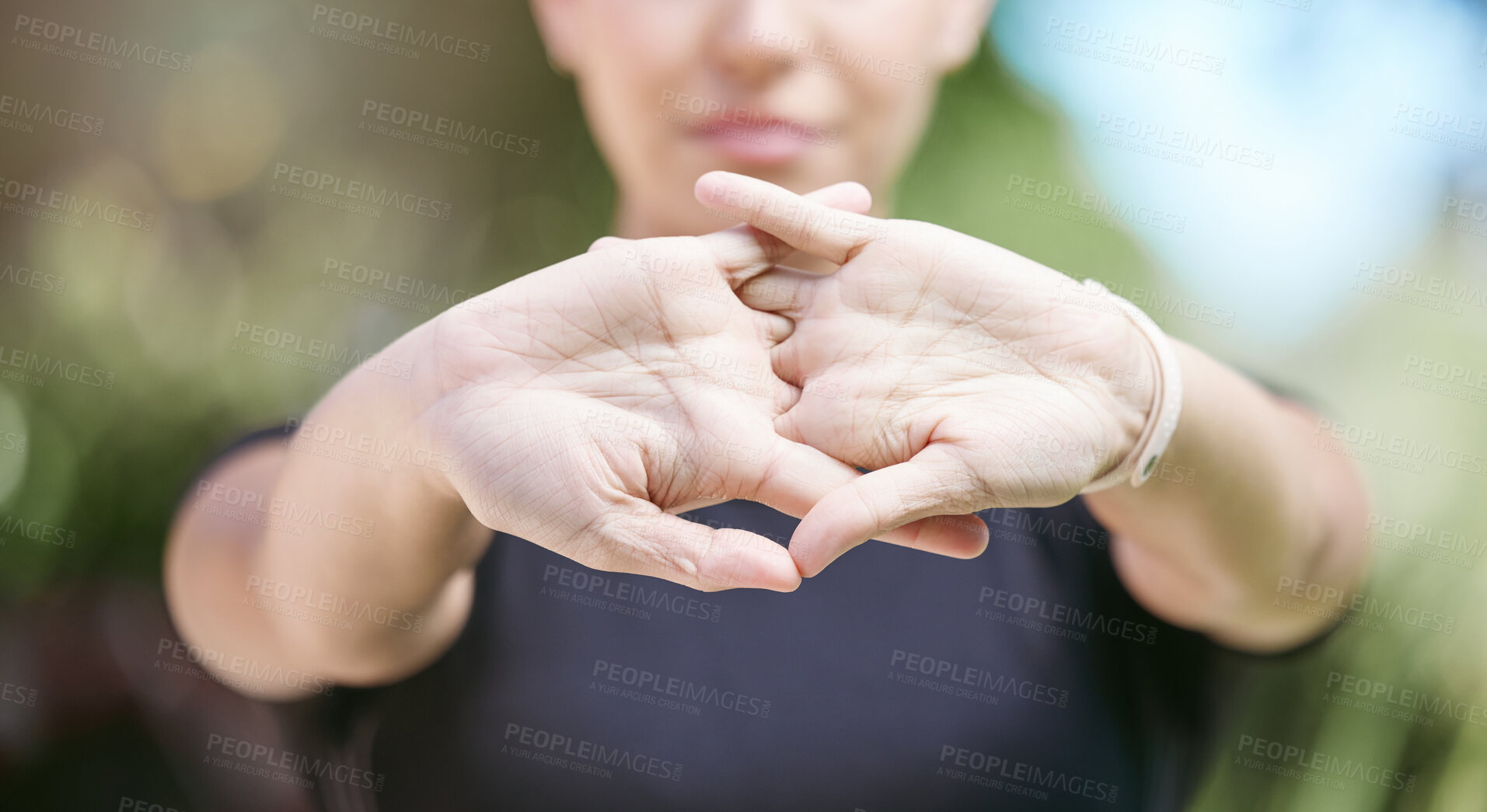 Buy stock photo Fitness, runner or person stretching hands for workout or body movement while relaxing on break. Closeup, hand or blurry athlete in exercise training warm up for flexibility or wrist mobility in park