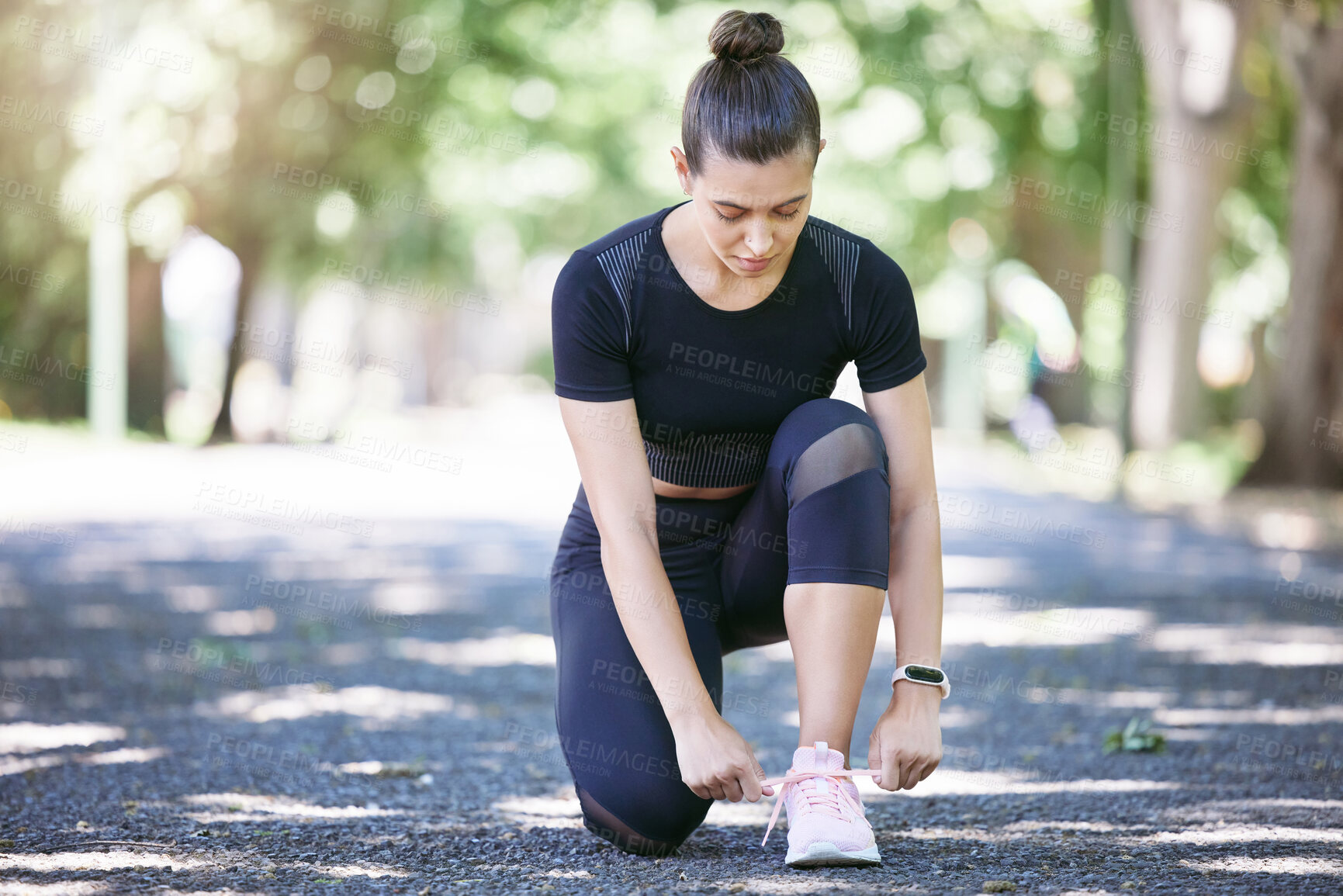 Buy stock photo Fitness, woman tying her shoelaces and running outdoors at a nature park. Workout or exercise, training or health wellness and female person prepare to run outside for motivation with shoes.