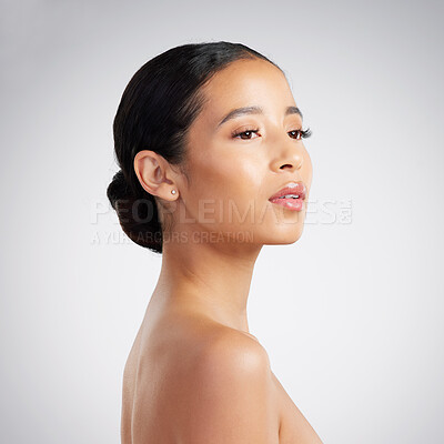 Buy stock photo A beautiful young mixed race woman with glowing skin posing against grey copyspace background. Hispanic woman with natural looking eyelash extensions is a confident natural beauty in a studio