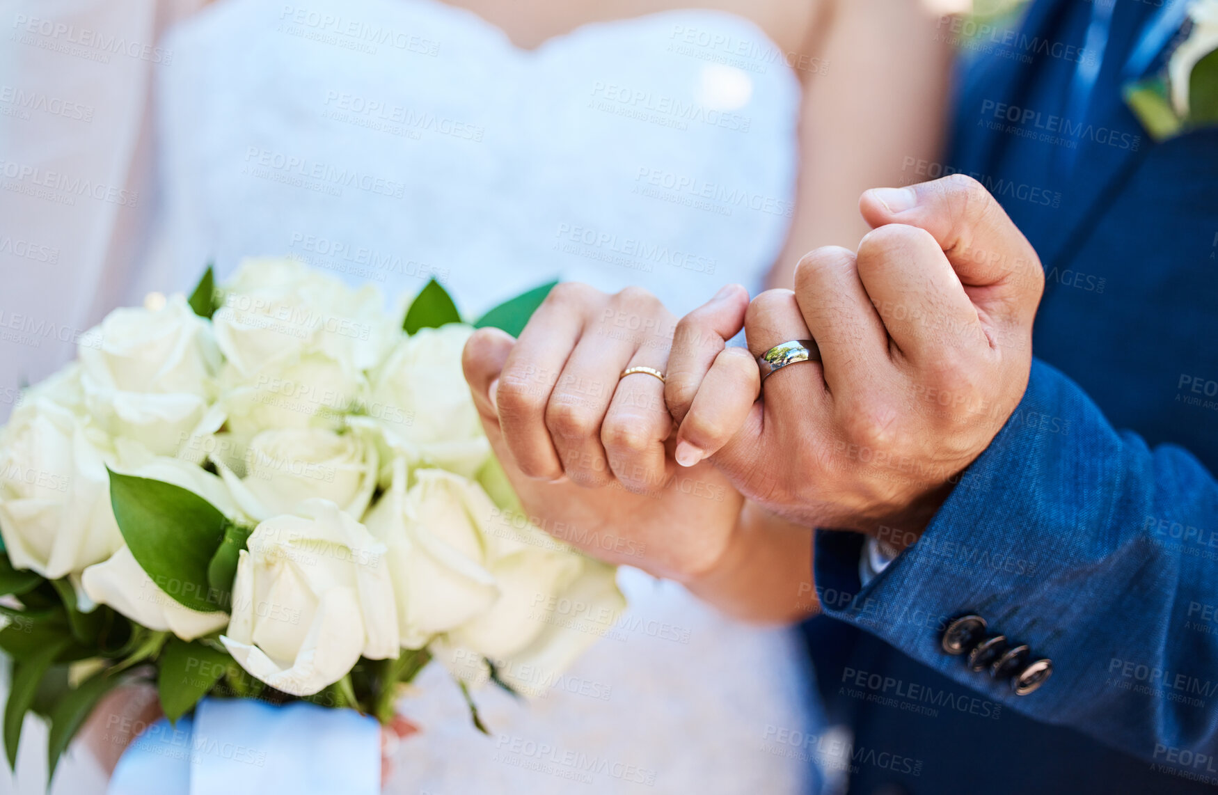 Buy stock photo Closeup view showing hands of bride and groom couple on wedding day with ring bands on fingers. Newlyweds with pinky fingers interlocked making promise