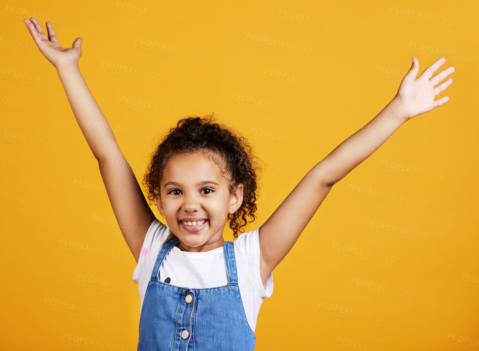 Buy stock photo Studio, portrait and excited child with hands up and smile on face on yellow background. Young girl kid with happiness, carefree and positive attitude or happy celebration or surprise announcement