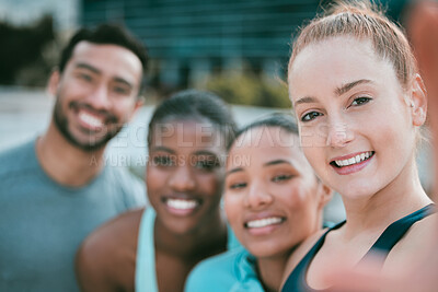 Buy stock photo Portrait of a diverse group of happy sporty people taking selfies while exercising together outside. Cheerful motivated athletes excited and ready for training workout. Supportive friends taking photos for social media