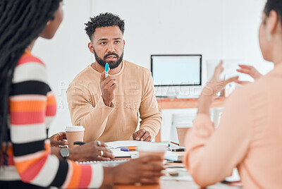Buy stock photo Group of diverse businesspeople having a meeting in a modern office at work. Young mixed race businessman talking about an idea sitting in a boardroom with colleagues. Creative businesspeople planning together