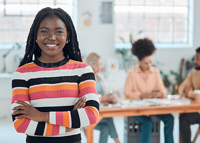 Buy stock photo Young happy african american businesswoman standing with her arms crossed while in an office. Confident black female boss smiling and standing at work