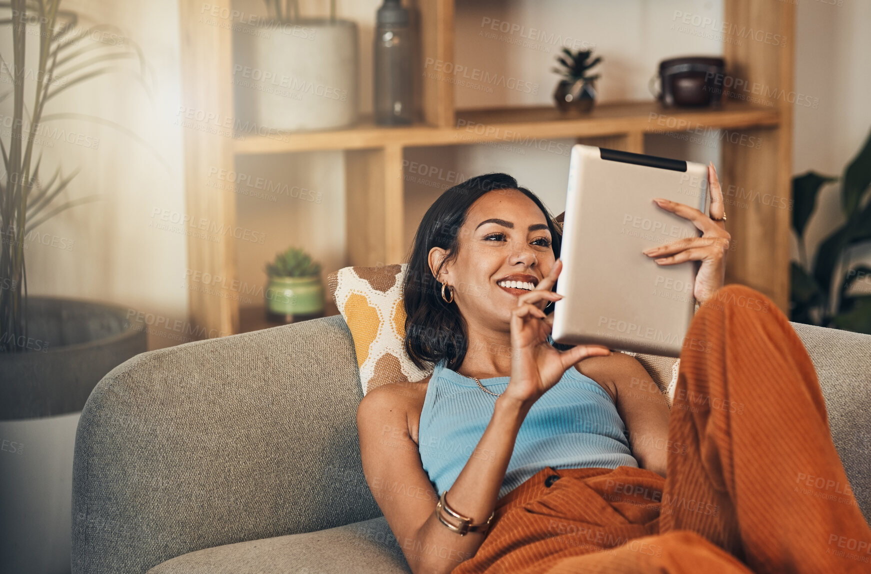Buy stock photo Woman relax on couch with tablet, online streaming with internet and reading ebook or watching film at home. Happy female person with technology, subscription and mobile app with break in living room