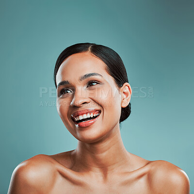 Buy stock photo A young beautiful mixed race woman with smooth soft skin posing and smiling against a green studio background. Attractive Hispanic female with stylish makeup posing in studio