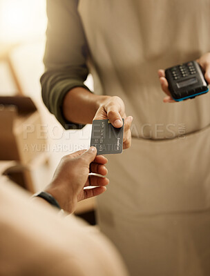 Closeup of customer paying bill with credit card. Businessman using contactless card machine for customer payment. Fashion designer accepting ecommerce payment.Entrepreneur using card machine