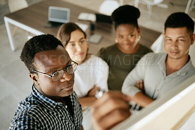 Buy stock photo African american business man coach mentor writing on board explaining idea and thoughts while brainstorming with colleagues. Diverse colleagues discussing ideas while collaborating on project