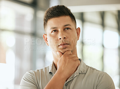 Buy stock photo Thoughtful mixed race young business man with hand on chin planning project, pondering ideas. Pensive professional thinking about future while standing in an office