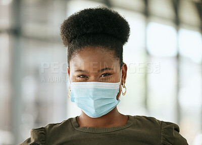 Buy stock photo African american business woman wearing protective face mask in the office for safety and protection during COVID-19. Happy mixed race female entrepreneur with glasses and mask at workplace
