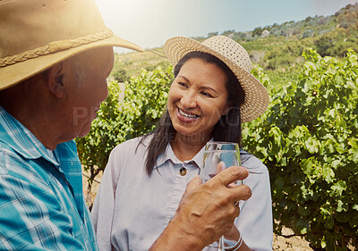 Buy stock photo Smiling mixed race couple toasting with wineglasses on vineyard. Happy hispanic husband and wife standing together and bonding during wine tasting on farm on weekend. Man and woman enjoying alcohol