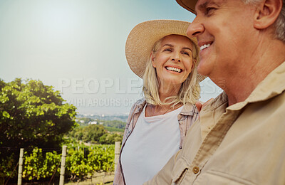 Smiling senior couple bonding during day on a farm with copyspace. Happy caucasian husband and wife standing close together on vineyard in summer. Elderly husband and wife feeling in love on wine farm