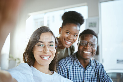 Buy stock photo Portrait of a group of young cheerful businesspeople taking a selfie together at work. Happy hispanic businesswoman taking a selfie with her colleagues in an office