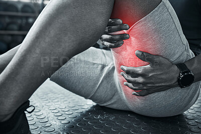 Buy stock photo Hands of a trainer holding his thigh in pain. Red CGI used to find spots of muscular pain on the body. Athletic bodybuilder sitting on the floor with muscle strain. Closeup of trainer in pain