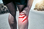 Closeup fit mixed race man holding his knee in pain while exercising outdoors. Unrecognizable male athlete suffering with a joint injury highlighted by glowing cgi. You can get hurt during a workout