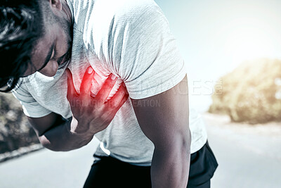 Buy stock photo Closeup fit mixed race man holding his chest in pain while exercising outdoors. Unrecognizable male athlete struggling to breath, having a heart attack or going into cardiac arrest, highlighted by cgi