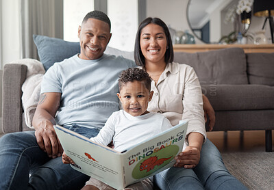 Buy stock photo Portrait, parents and child reading books on living room floor for educational fun, learning and development at home. Happy family, boy kid and relax for storytelling, knowledge and dinosaur animals