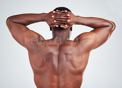 Buy stock photo Rear view of one African American fitness model posing against a white background. Unrecognizable black man showing off his muscular shape while  isolated on white copyspace