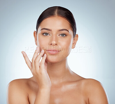 Buy stock photo Face, serious skincare and beauty of woman in studio isolated on a white background. Portrait, natural and female model in makeup, cosmetics or facial treatment for skin health, aesthetic or wellness