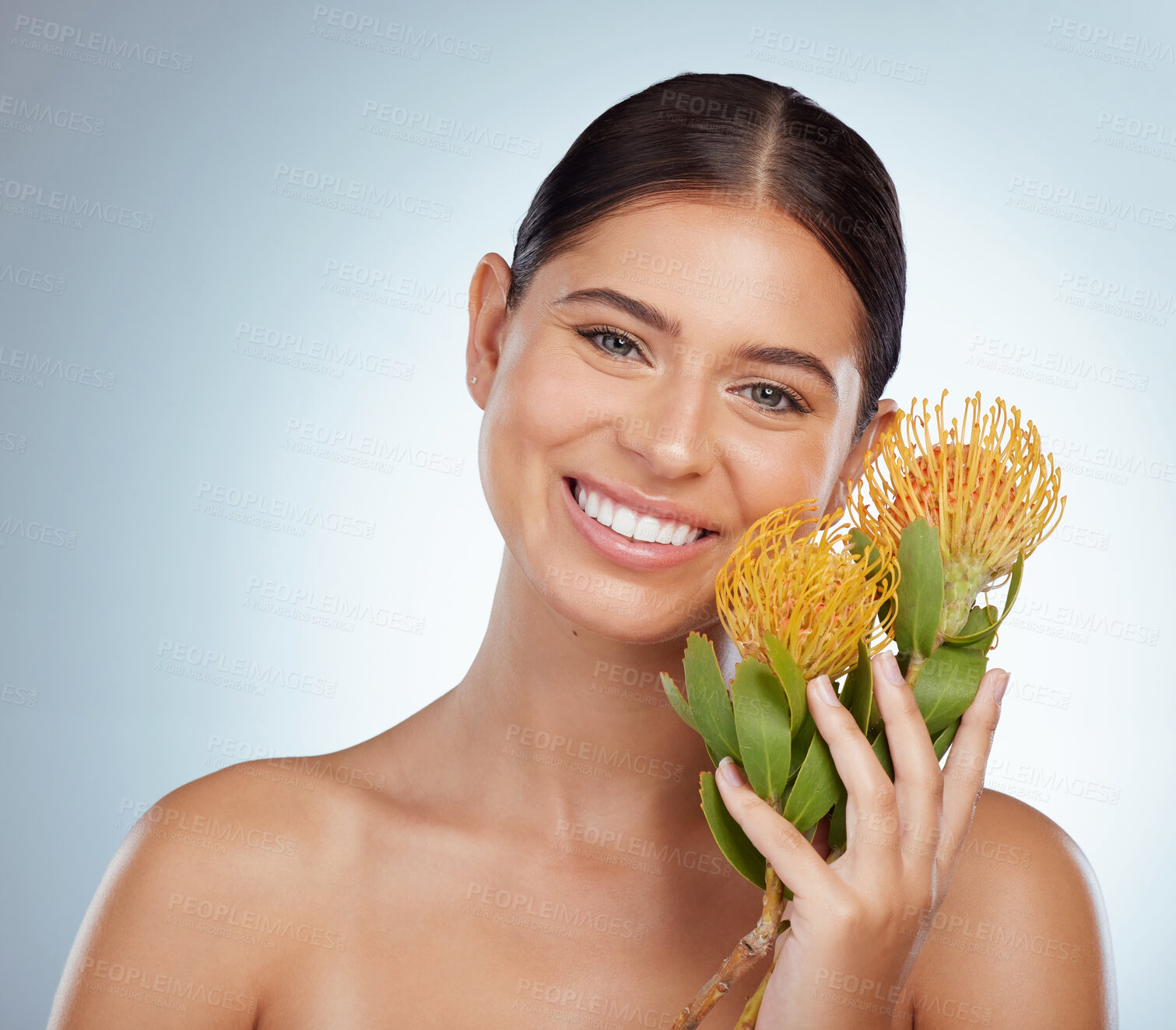 Buy stock photo Face, skincare and happy woman with flowers in studio isolated on a white background. Portrait, natural and female model with floral pincushion protea plants for makeup, cosmetics or beauty treatment
