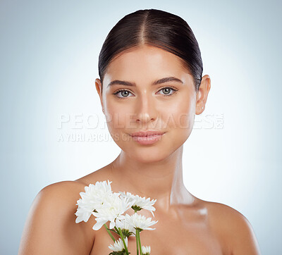 Buy stock photo Skincare, face and woman with daisy flower in studio isolated on a white background. Portrait, natural plant and female model with spring floral for makeup cosmetics, beauty treatment and wellness.
