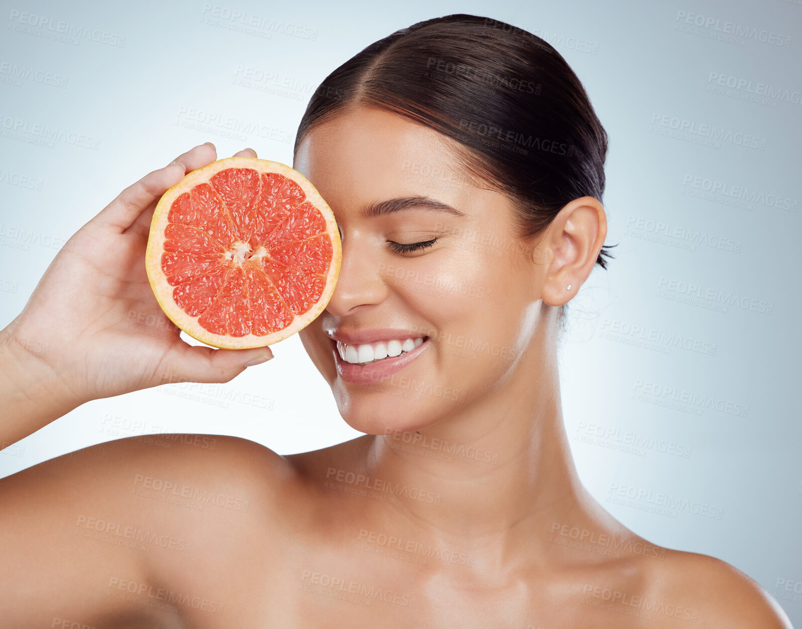 Buy stock photo Face smile, skincare and woman with grapefruit in studio isolated on a white background. Vegan, natural and female model with fruit for vitamin c, nutrition or healthy diet, wellness or cosmetics.