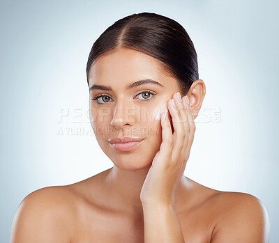 Buy stock photo Skincare, face and beauty of woman with lotion in studio isolated on a white background. Portrait, dermatology cream and female model apply cosmetics, sunscreen or moisturizer product for skin health