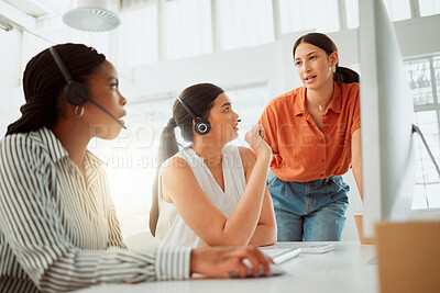 Buy stock photo Young hispanic call centre telemarketing agent training new assistants on a computer in an office. Team leader troubleshooting solution with interns for customer service and sales support. Colleagues operating helpdesk together