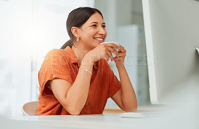 Buy stock photo One confident young hispanic business woman drinking coffee while working on a computer in an office. Happy entrepreneur browsing the internet while planning inspiring ideas at her desk in a creative startup agency