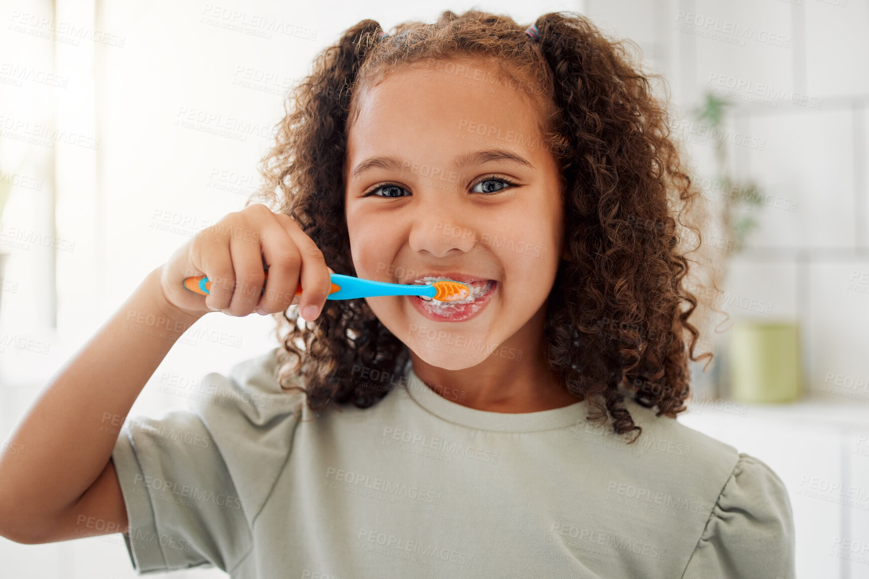 Buy stock photo Toothbrush, brushing teeth and portrait of a child in a home bathroom for dental health and wellness with smile. Face of Latino girl kid learning to clean her mouth for morning routine and oral care