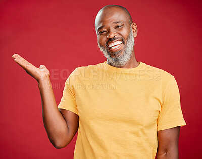 Buy stock photo Mature african american man with a beard smiling and making a hand gesture standing against a red studio background. Happy, smiling, showing
