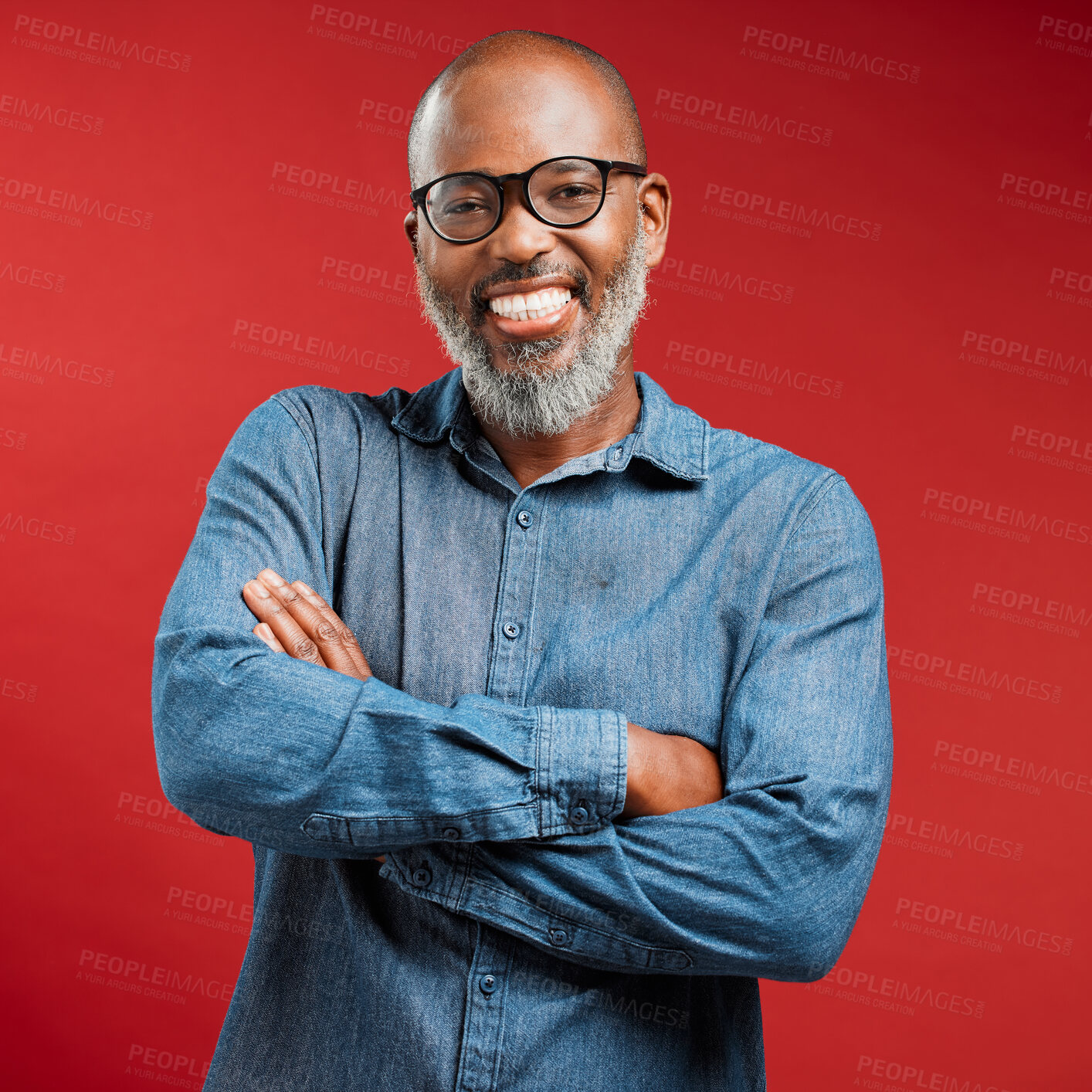 Buy stock photo Mature African American man wearing glasses and smiling while posing against a red background. Black male happy with his new spectacles frame at his optometry checkup. Improved vision makes him smile 
