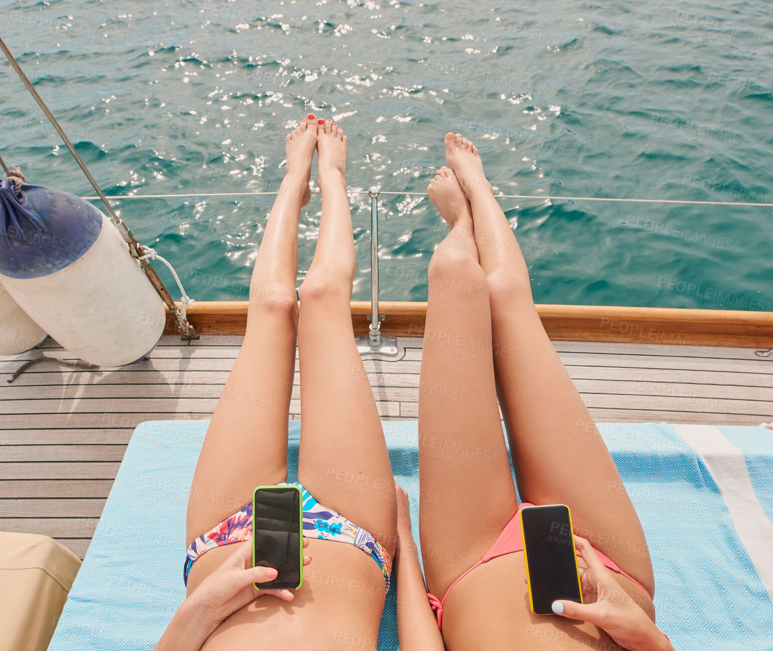 Buy stock photo Travel, friends and women with phone on yacht relax for cruise on holiday, vacation or adventure at sea. Luxury sailing, sunbathing and female people on smartphone for social media, internet and text