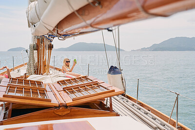Buy stock photo Travel, picture and women with phone on yacht relax for cruise on holiday, vacation and adventure at sea. Luxury sailing, boat and female person on smartphone for social media, online and selfie