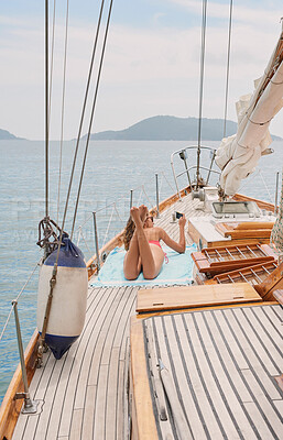 Buy stock photo Travel, yacht and women with phone on boat relax for cruise on holiday, vacation and adventure at sea. Luxury sailing, sunbathing and female person on smartphone for social media, memories and online