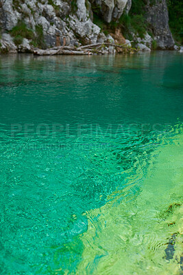 Buy stock photo Beautiful nature landscape of a blue river flowing though an exotic evergreen travel destination. Clear water of a lake on a summer day