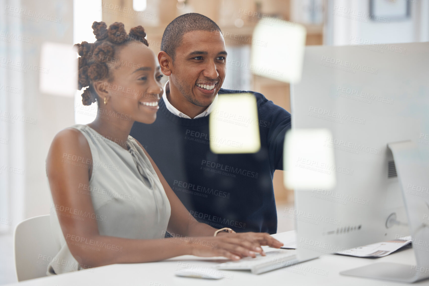 Buy stock photo Collaboration, colleagues working together and at computer in their modern workplace office. Teamwork or partnership, support or and mentor with coworker at her pc typing with help at workstation